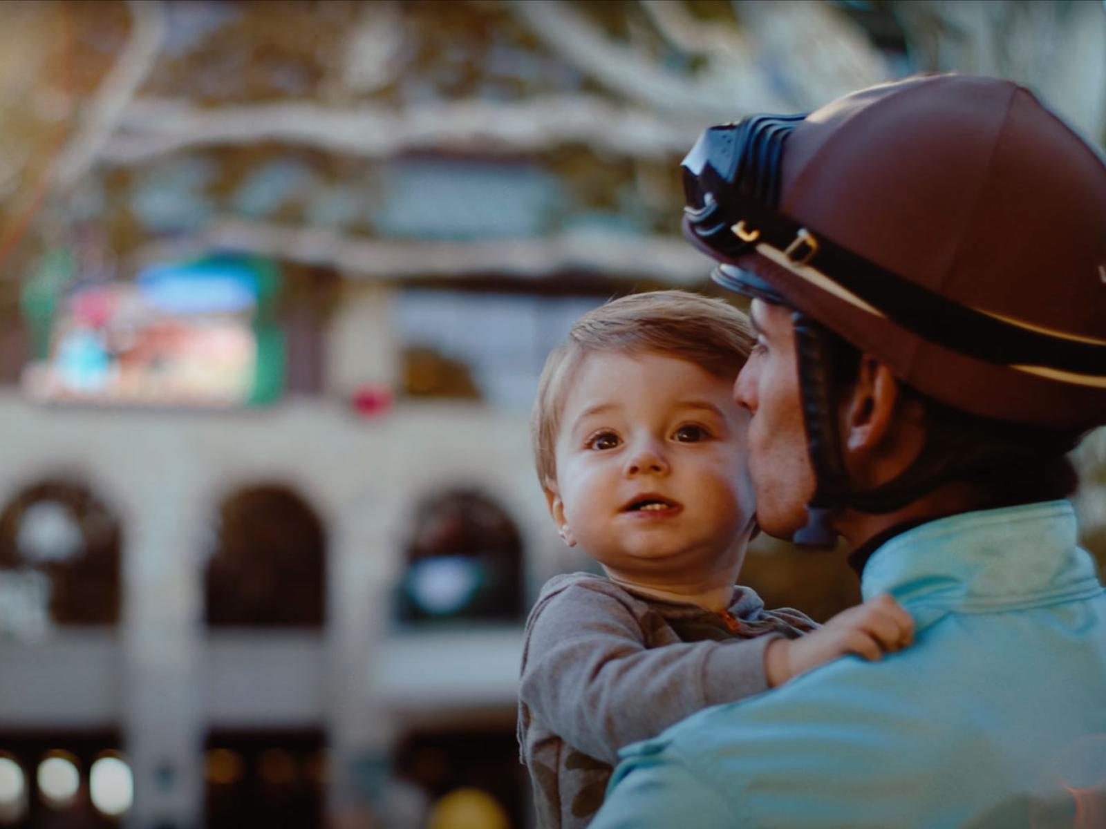 Jockey kissing his son.